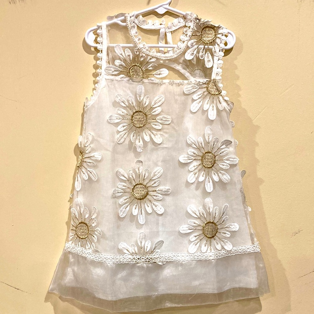White/ golden dress with hand sewn decorations along with white decorated socks